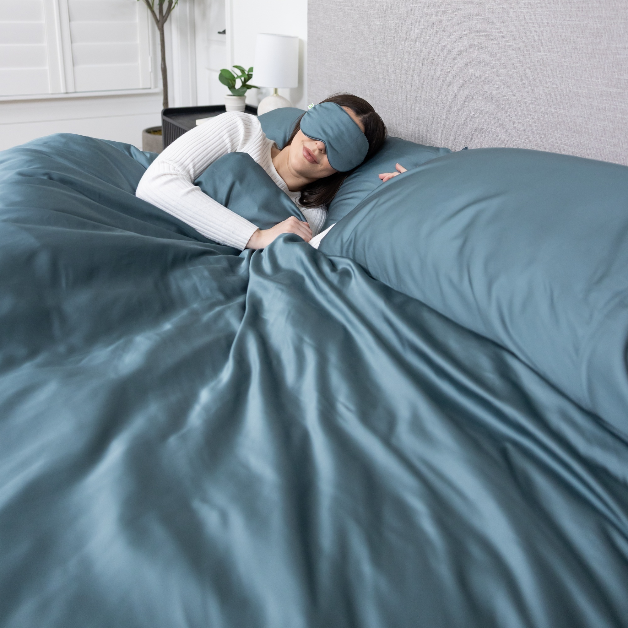Luxurious organic bamboo duvet cover set with matching pillowcases and sleep mask.