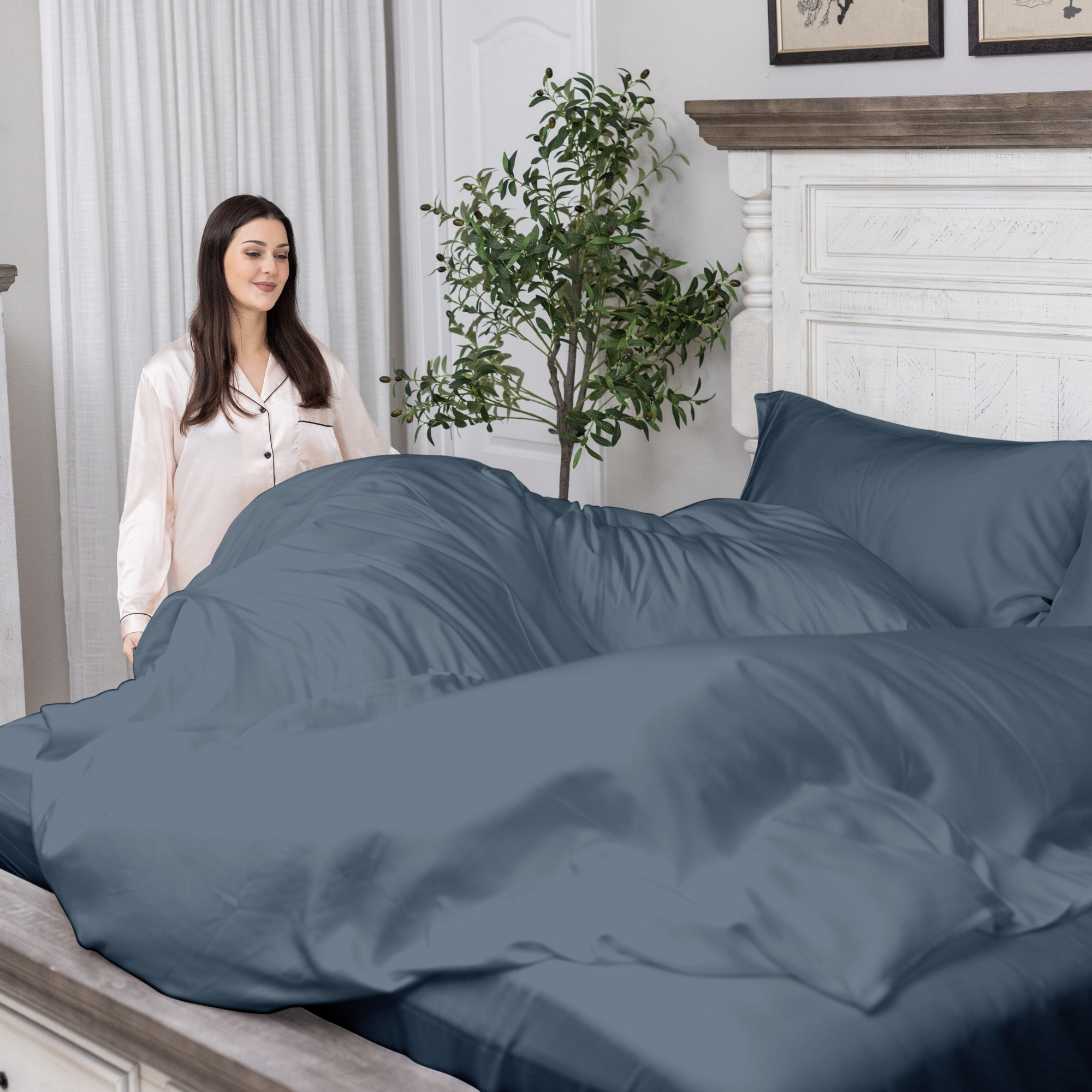Ocean blue organic bamboo cooling sheets set on bed in bedroom.
