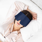 Woman sleeping with Elysium Silk Eye Mask in Navy 